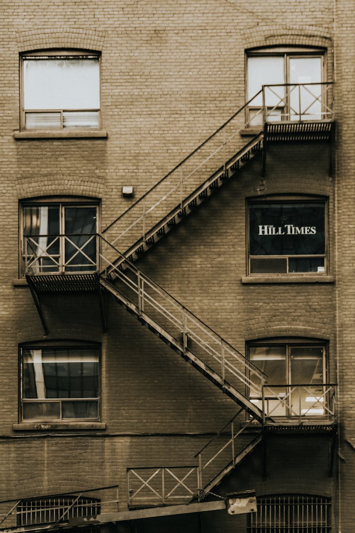 A historic brick building facade with a fire escape in Ottawa, Ontario.